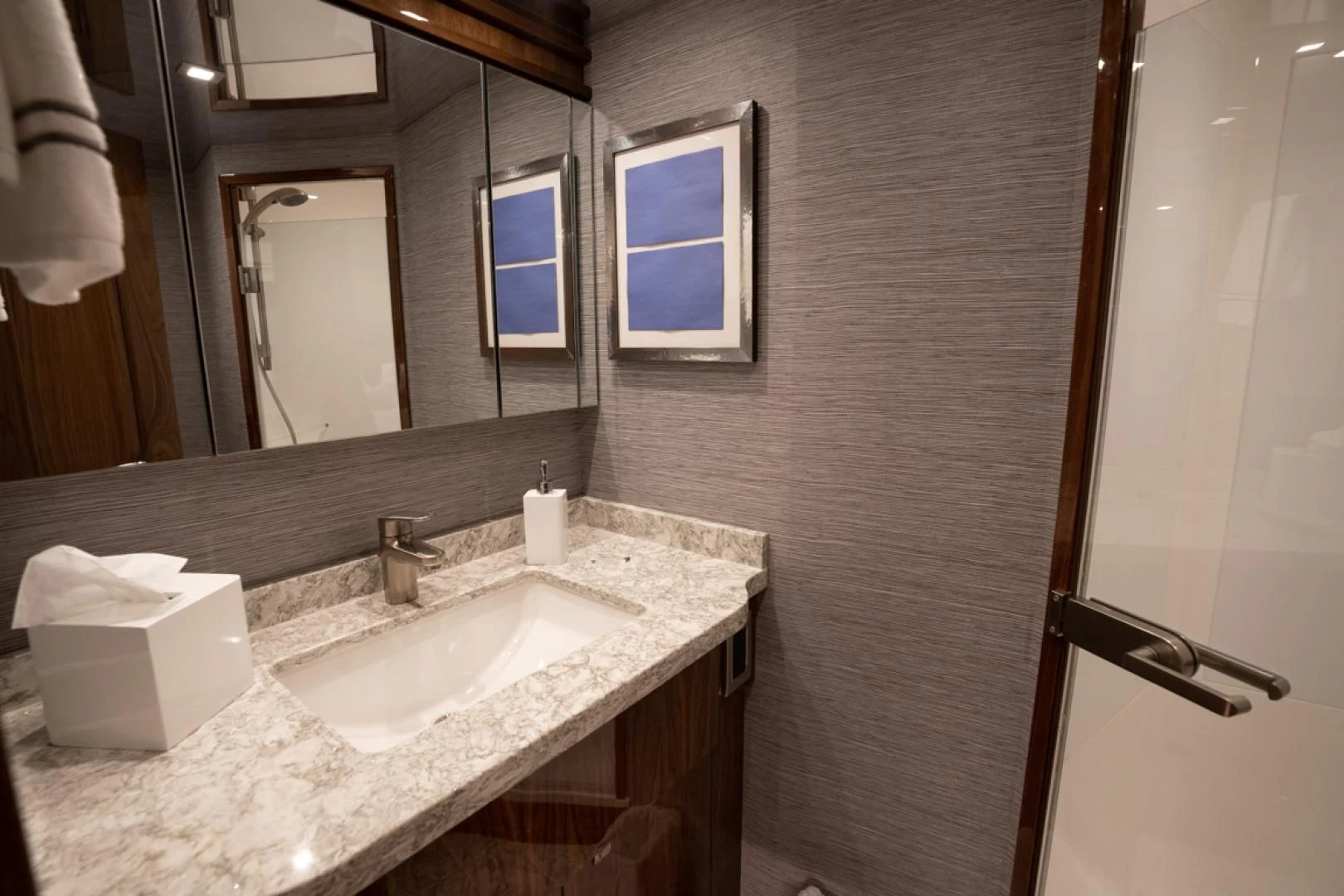 a bathroom with a sink and mirror aboard MAKE IT HAPPEN Yacht for Sale