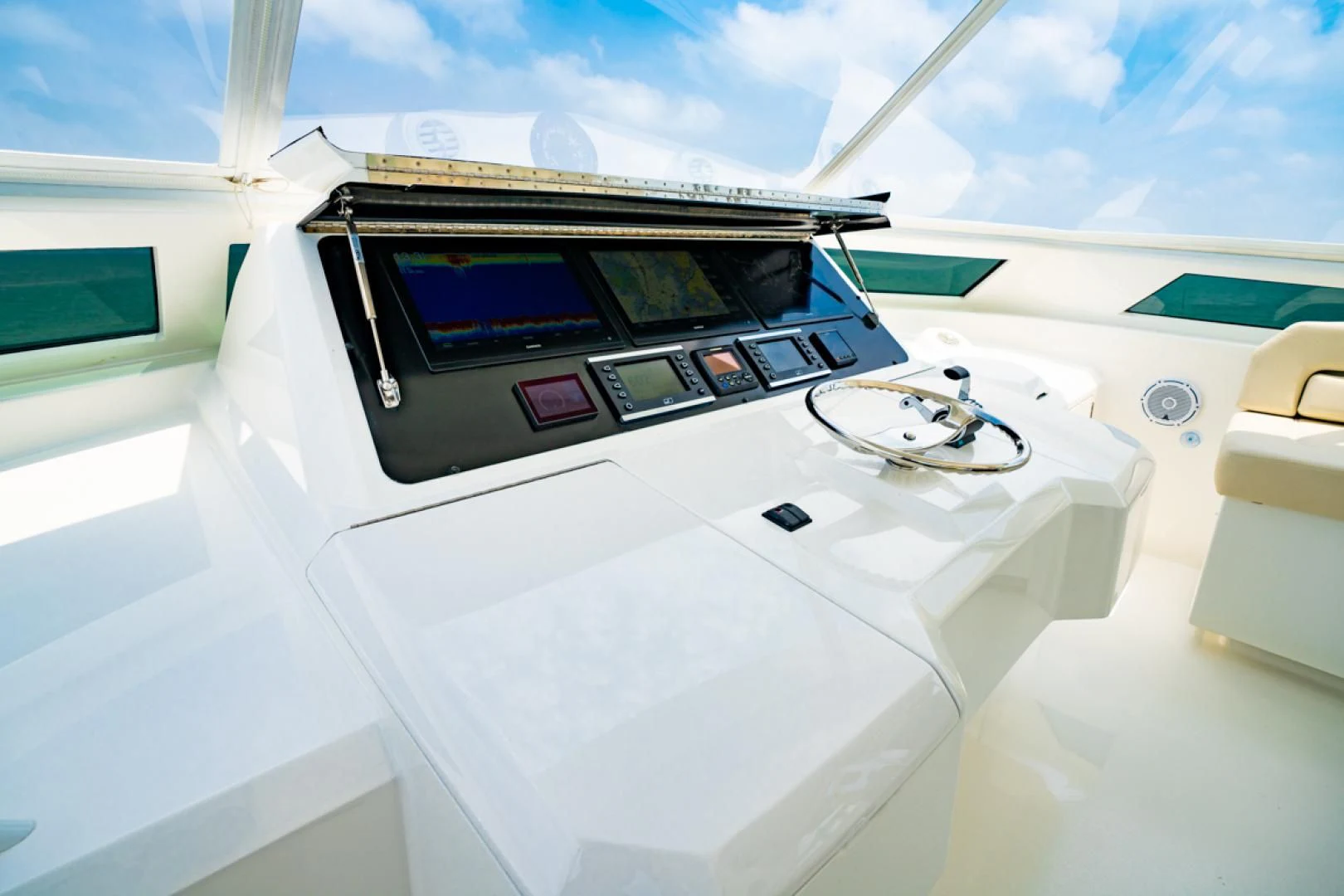 a white car with a screen aboard MAKE IT HAPPEN Yacht for Sale
