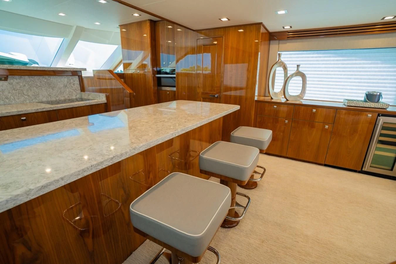 a large kitchen with wooden cabinets aboard MAKE IT HAPPEN Yacht for Sale