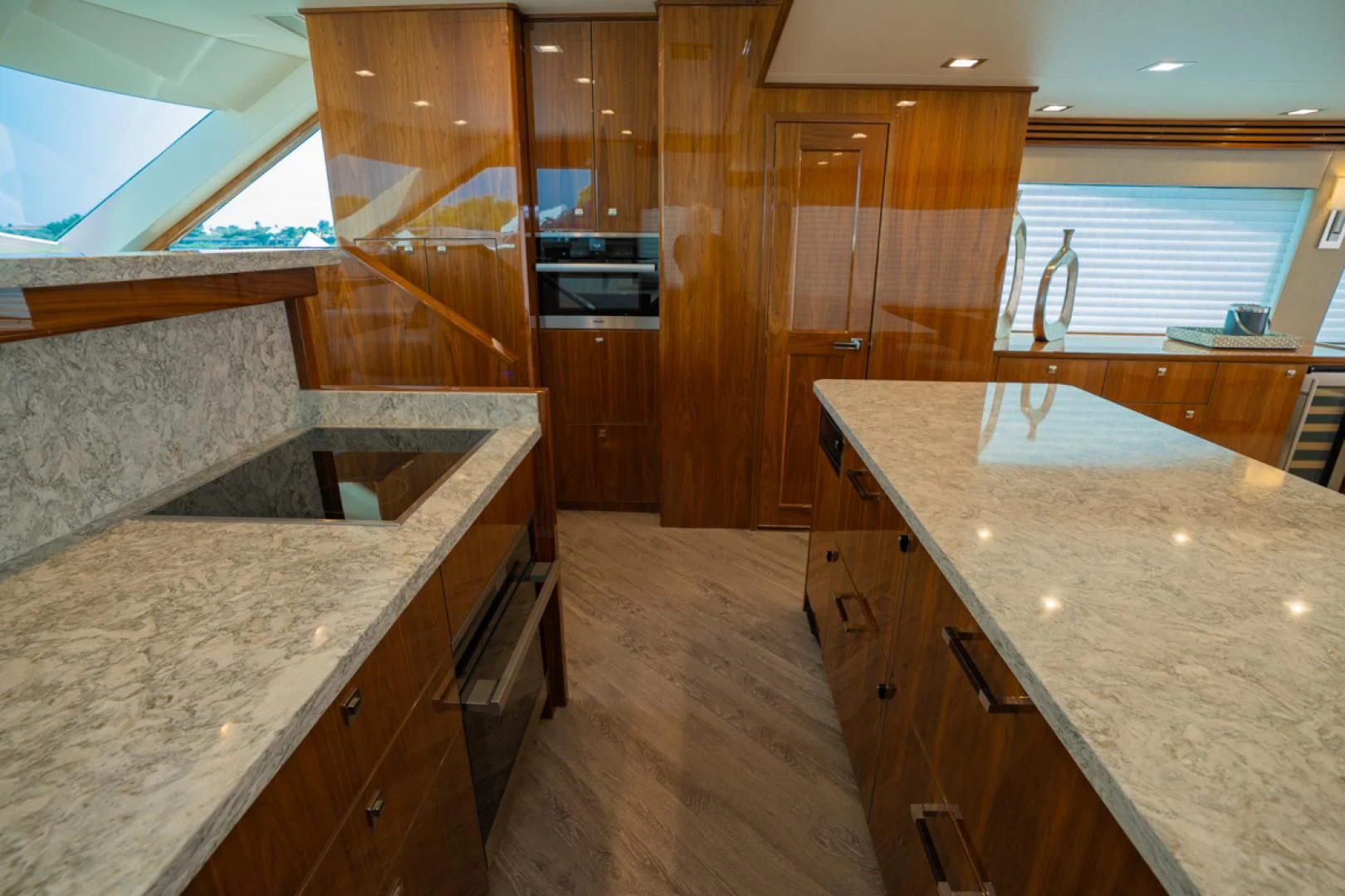 a kitchen with wooden cabinets aboard MAKE IT HAPPEN Yacht for Sale