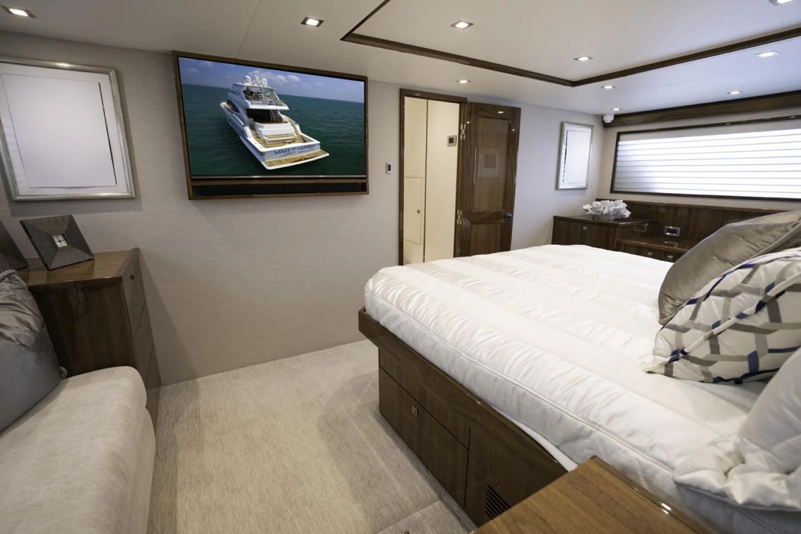 a bedroom with a large television aboard MAKE IT HAPPEN Yacht for Sale