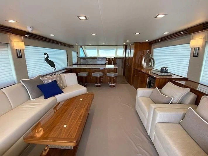 a living room with a large window aboard MAKE IT HAPPEN Yacht for Sale
