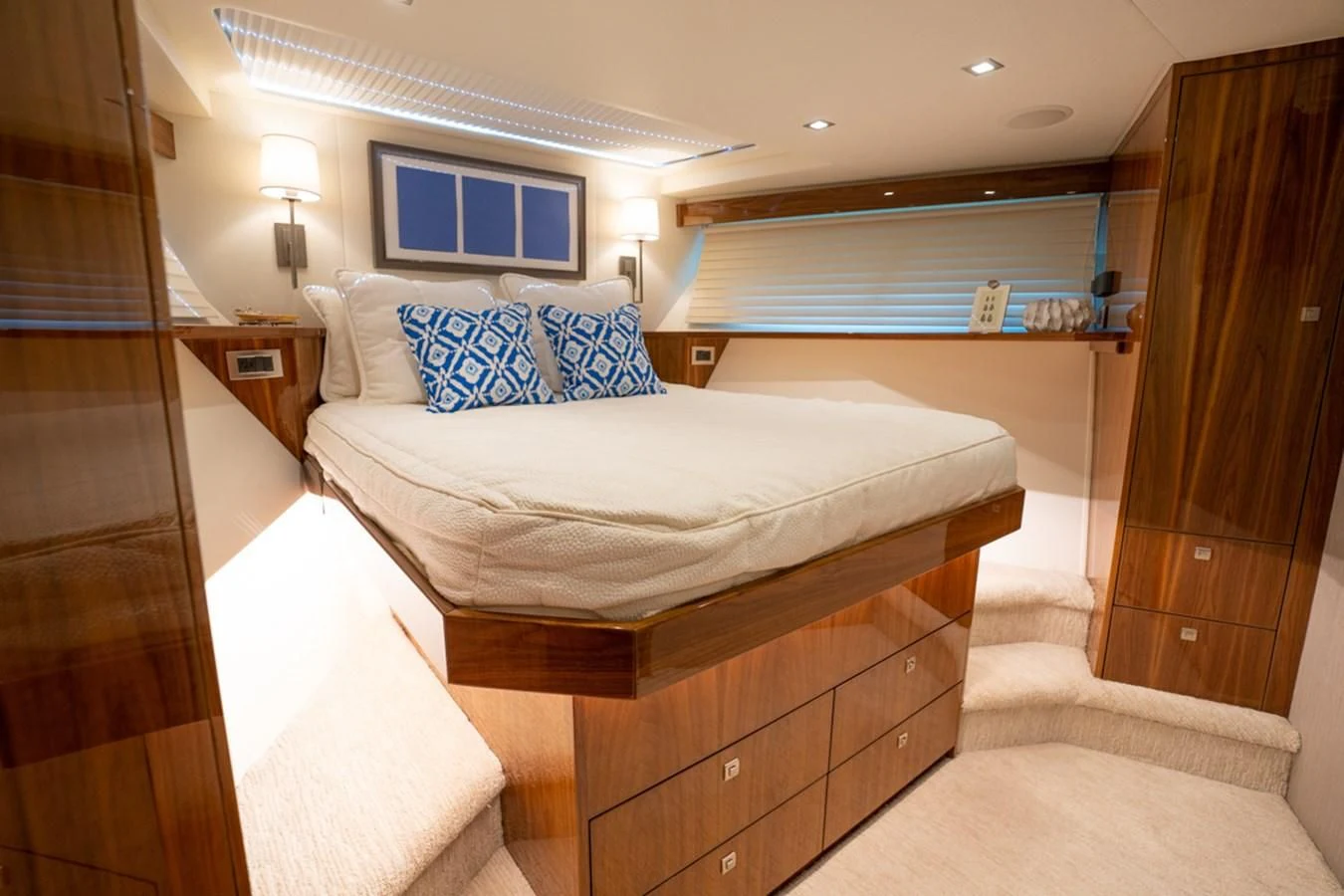 a bedroom with a bed and a dresser aboard MAKE IT HAPPEN Yacht for Sale