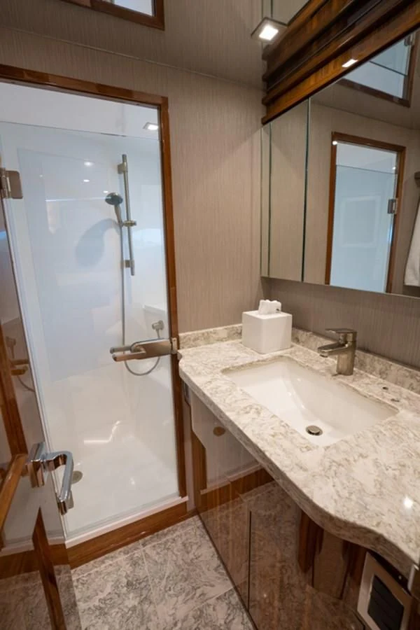 a bathroom with a sink and a mirror aboard MAKE IT HAPPEN Yacht for Sale