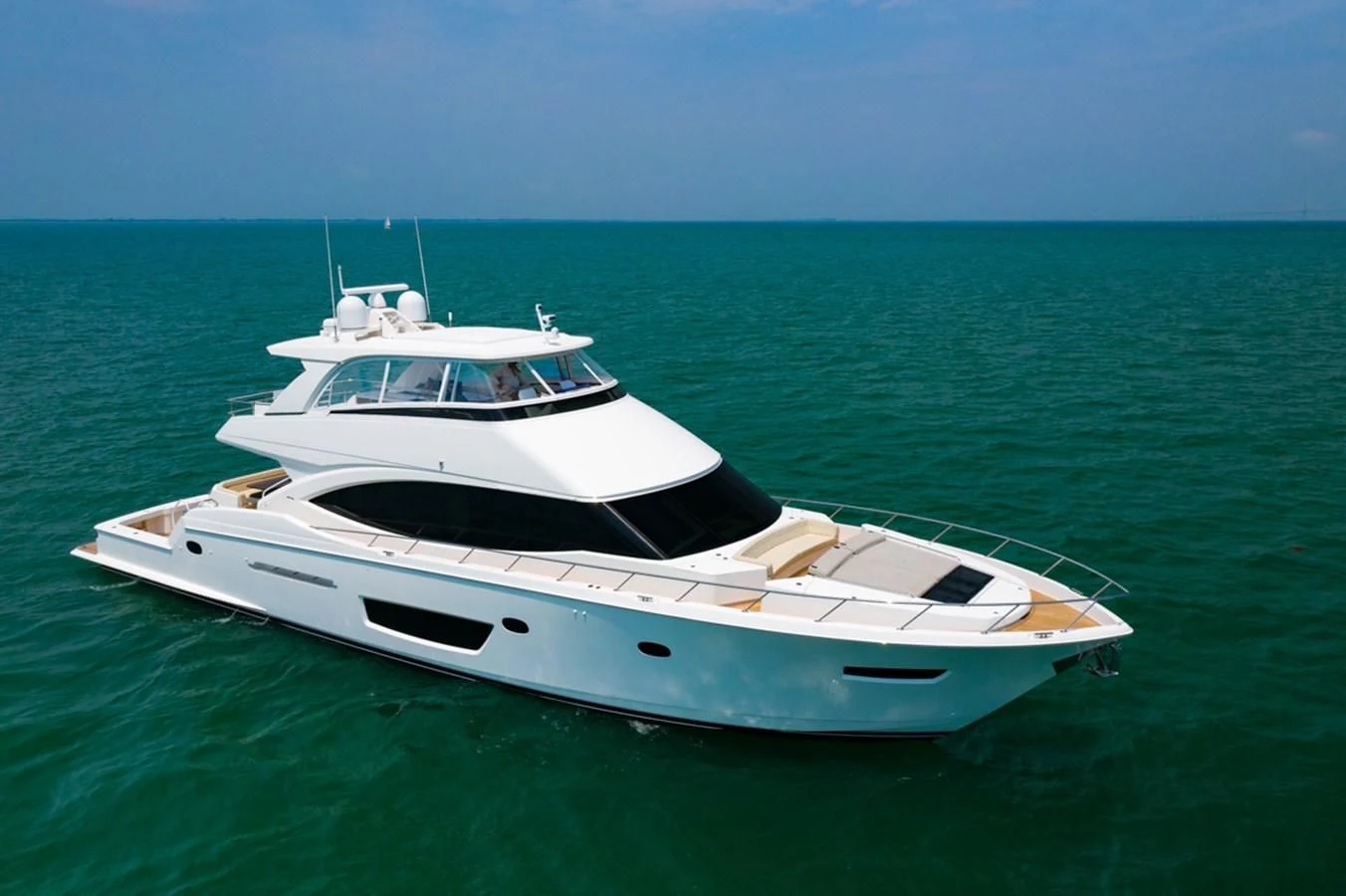 a white yacht in the ocean aboard MAKE IT HAPPEN Yacht for Sale