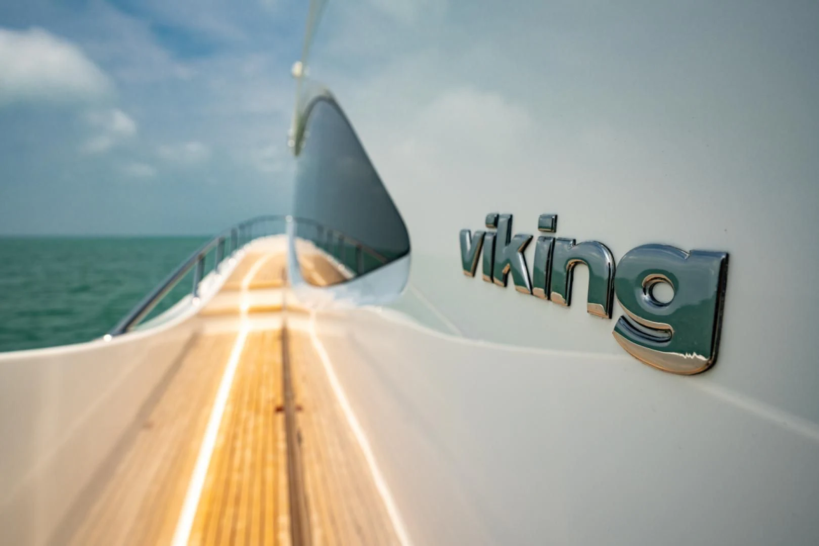 a boat with a logo on the front aboard MAKE IT HAPPEN Yacht for Sale