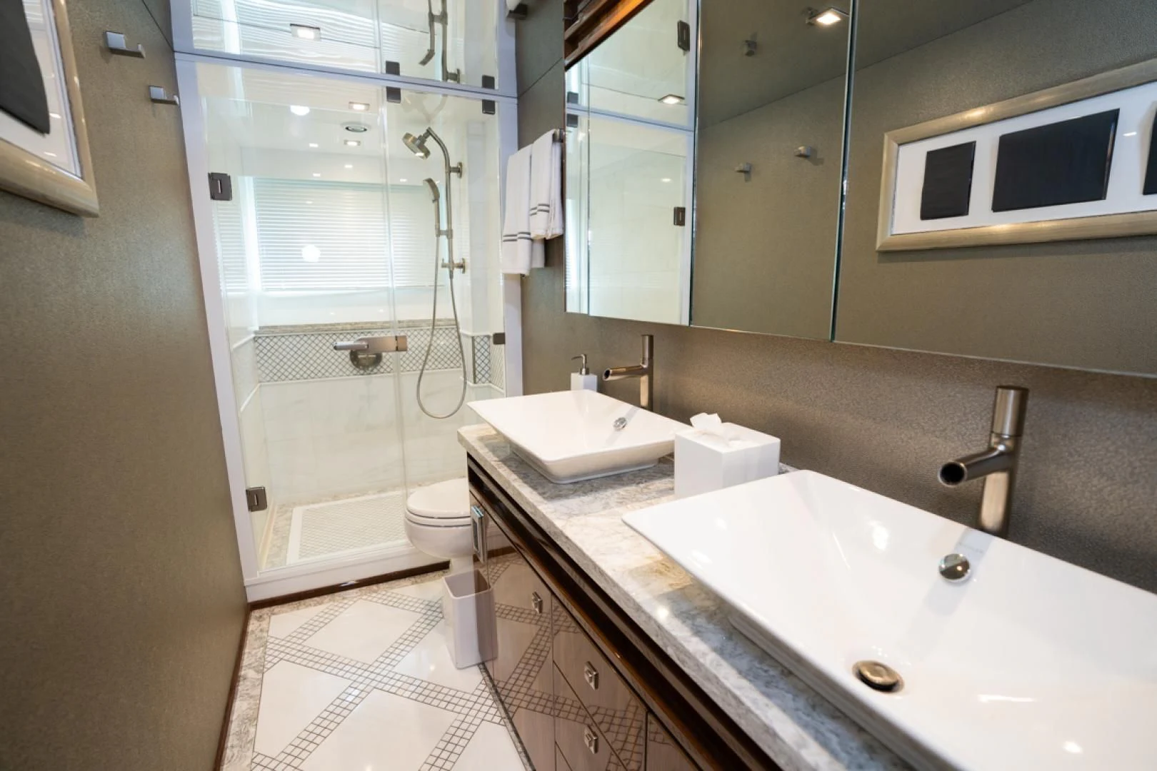 a bathroom with a sink and a mirror aboard MAKE IT HAPPEN Yacht for Sale