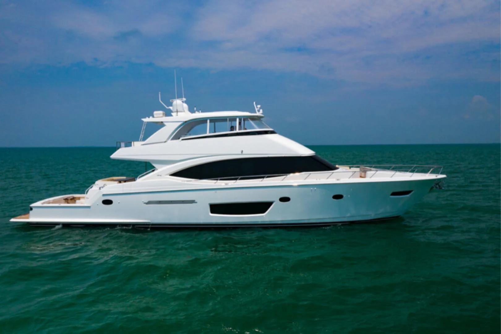 a white yacht in the ocean aboard MAKE IT HAPPEN Yacht for Sale