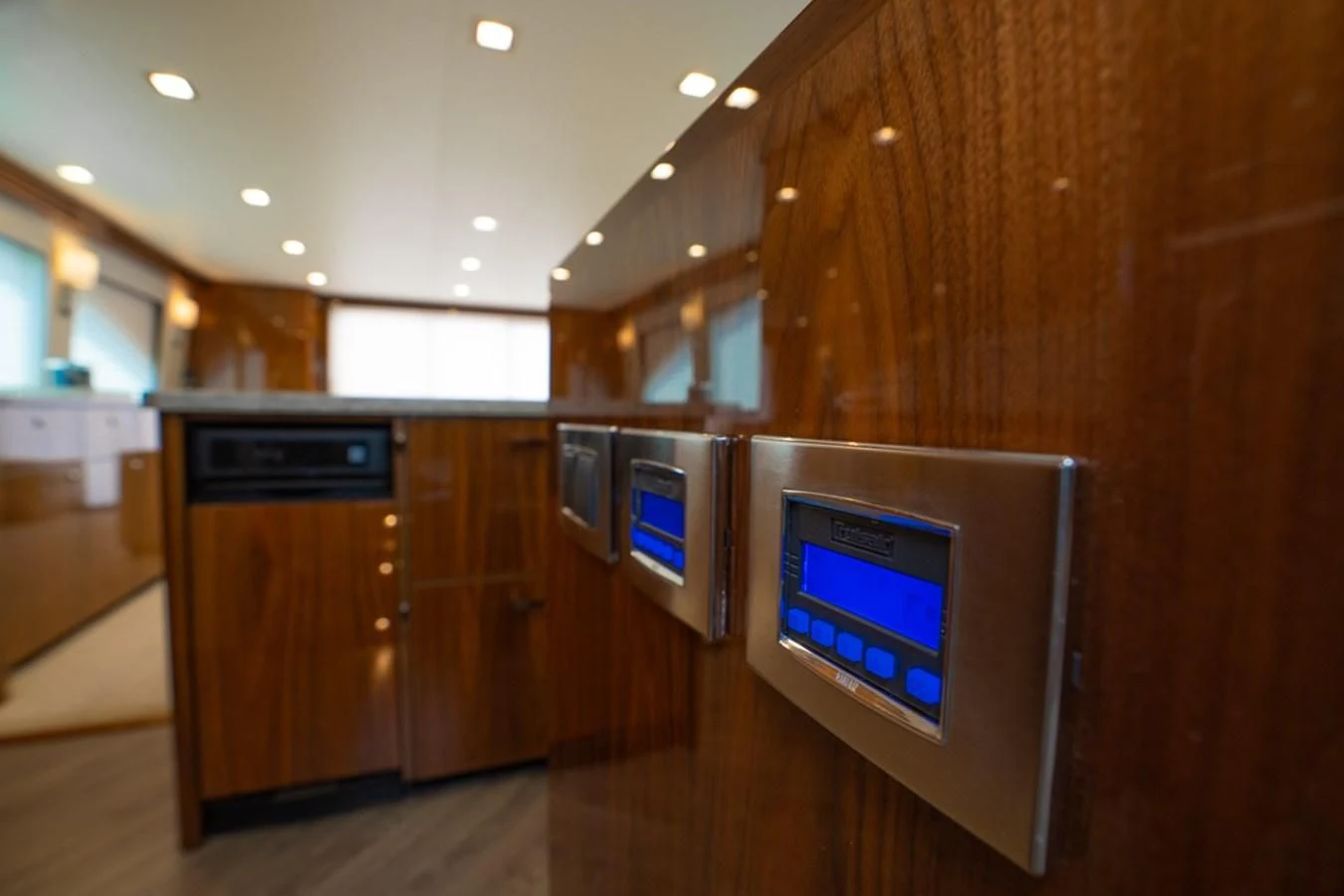a kitchen with wooden cabinets aboard MAKE IT HAPPEN Yacht for Sale