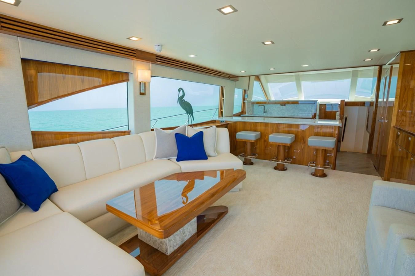 a large living room with a large glass window aboard MAKE IT HAPPEN Yacht for Sale