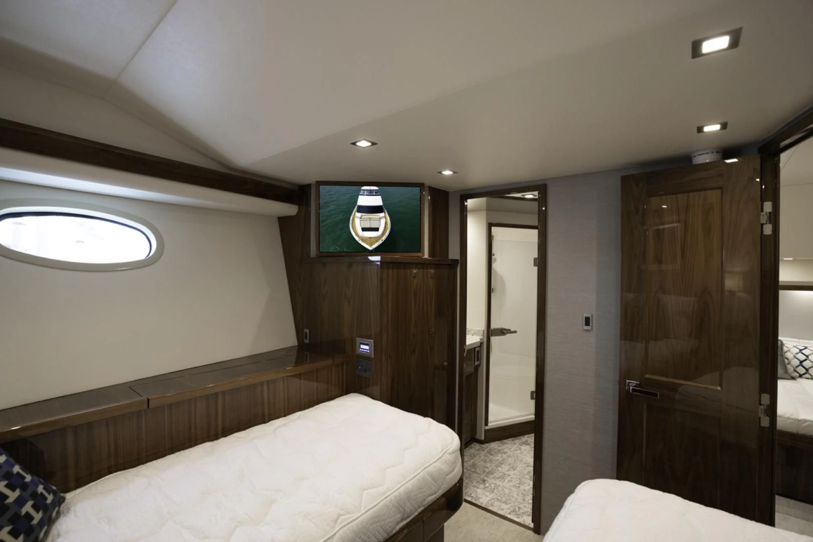 a room with a bed and a door aboard MAKE IT HAPPEN Yacht for Sale