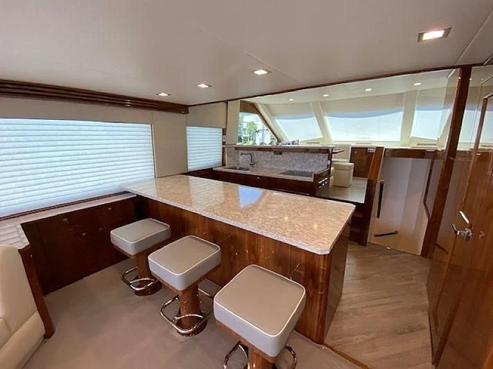 a bathroom with a countertop sink and stools aboard MAKE IT HAPPEN Yacht for Sale