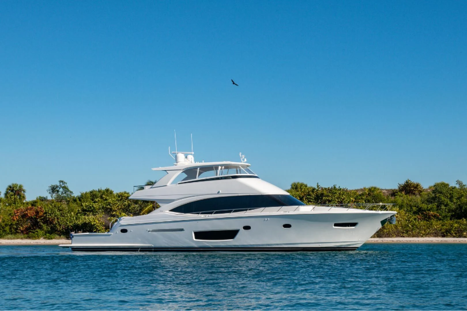 a white yacht on the water aboard MAKE IT HAPPEN Yacht for Sale