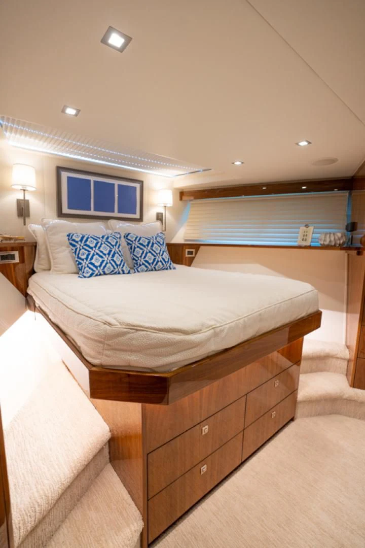 a room with a bed and a window aboard MAKE IT HAPPEN Yacht for Sale
