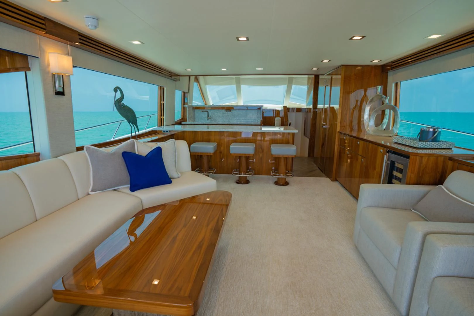 a living room with a large window aboard MAKE IT HAPPEN Yacht for Sale
