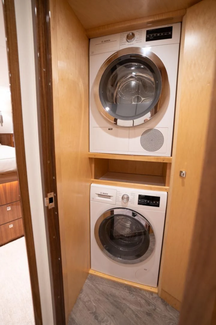 a washer and dryer in a room aboard MAKE IT HAPPEN Yacht for Sale