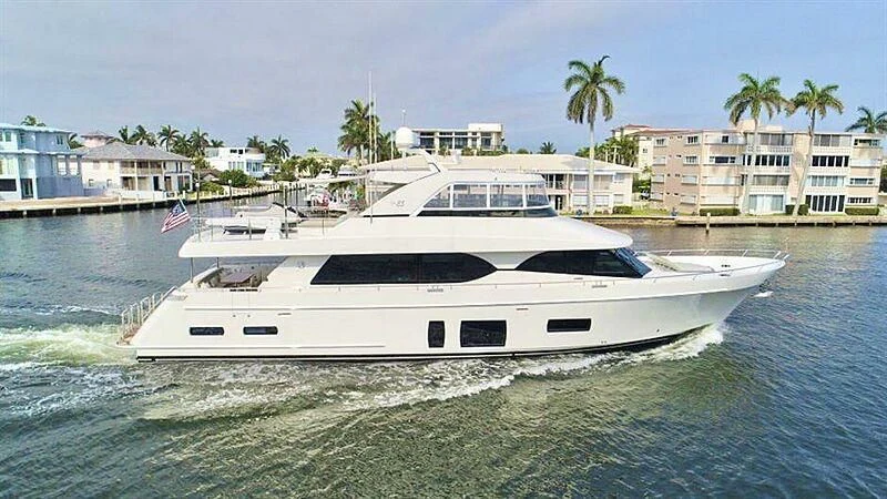 a white yacht on the water aboard TRAVELER TOO Yacht for Sale