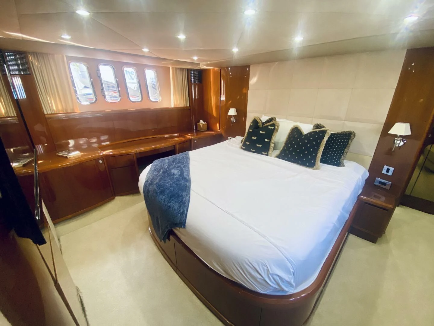 a room with a bed and a desk aboard GRAND CRU Yacht for Sale