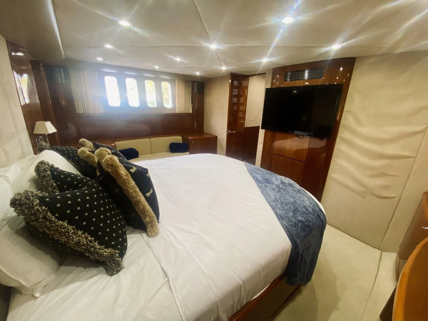 a bed with pillows aboard GRAND CRU Yacht for Sale
