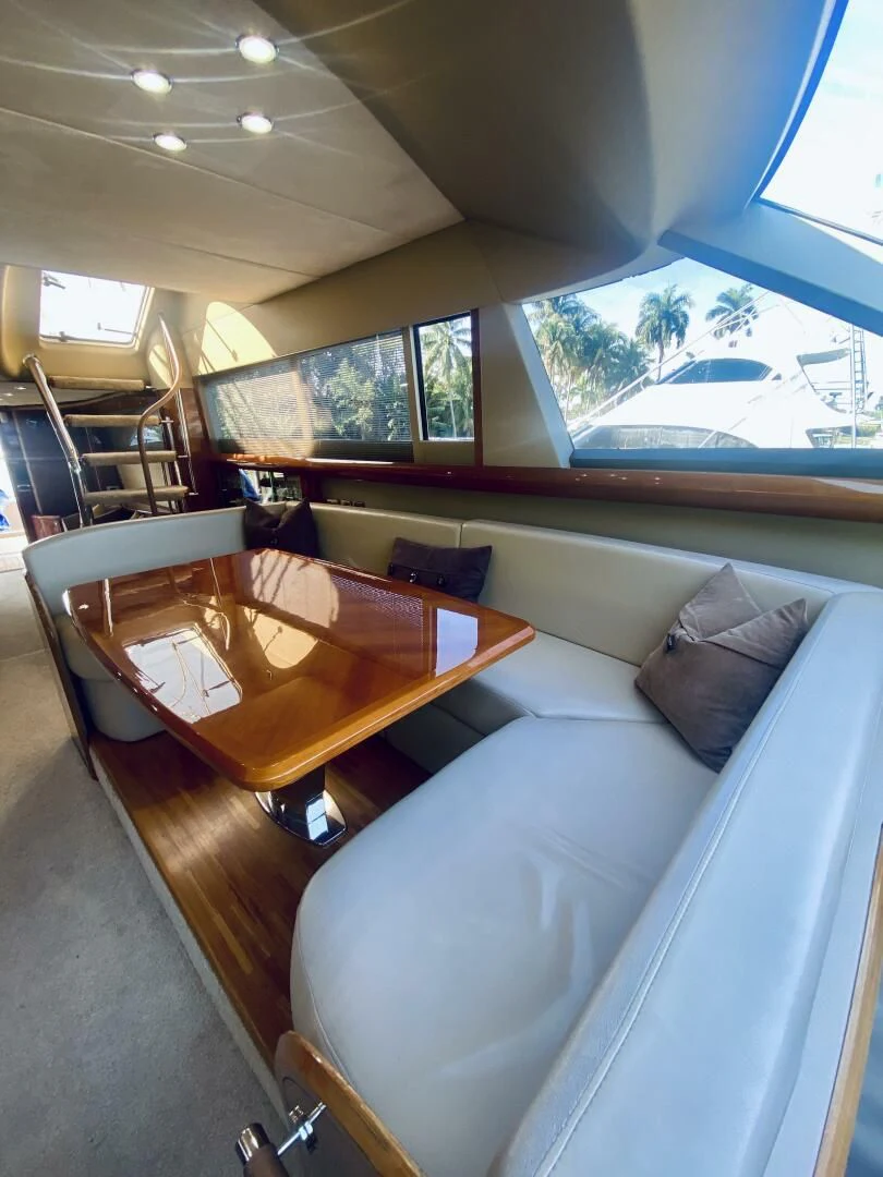 a living room with a couch and a table aboard GRAND CRU Yacht for Sale