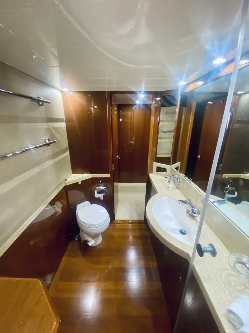 a bathroom with a sink toilet and bathtub aboard GRAND CRU Yacht for Sale