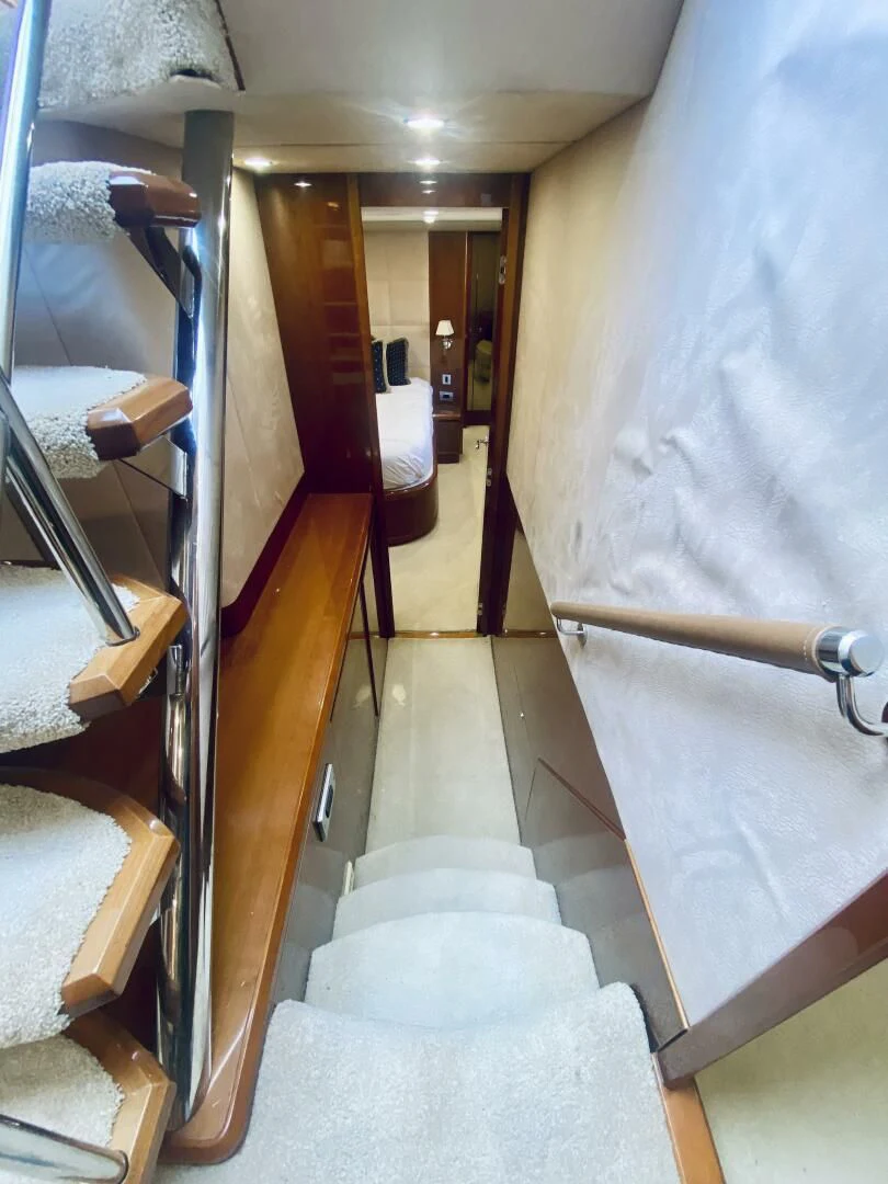 a hallway with a white wall aboard GRAND CRU Yacht for Sale