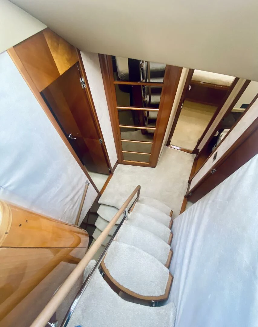 a staircase with a railing aboard GRAND CRU Yacht for Sale