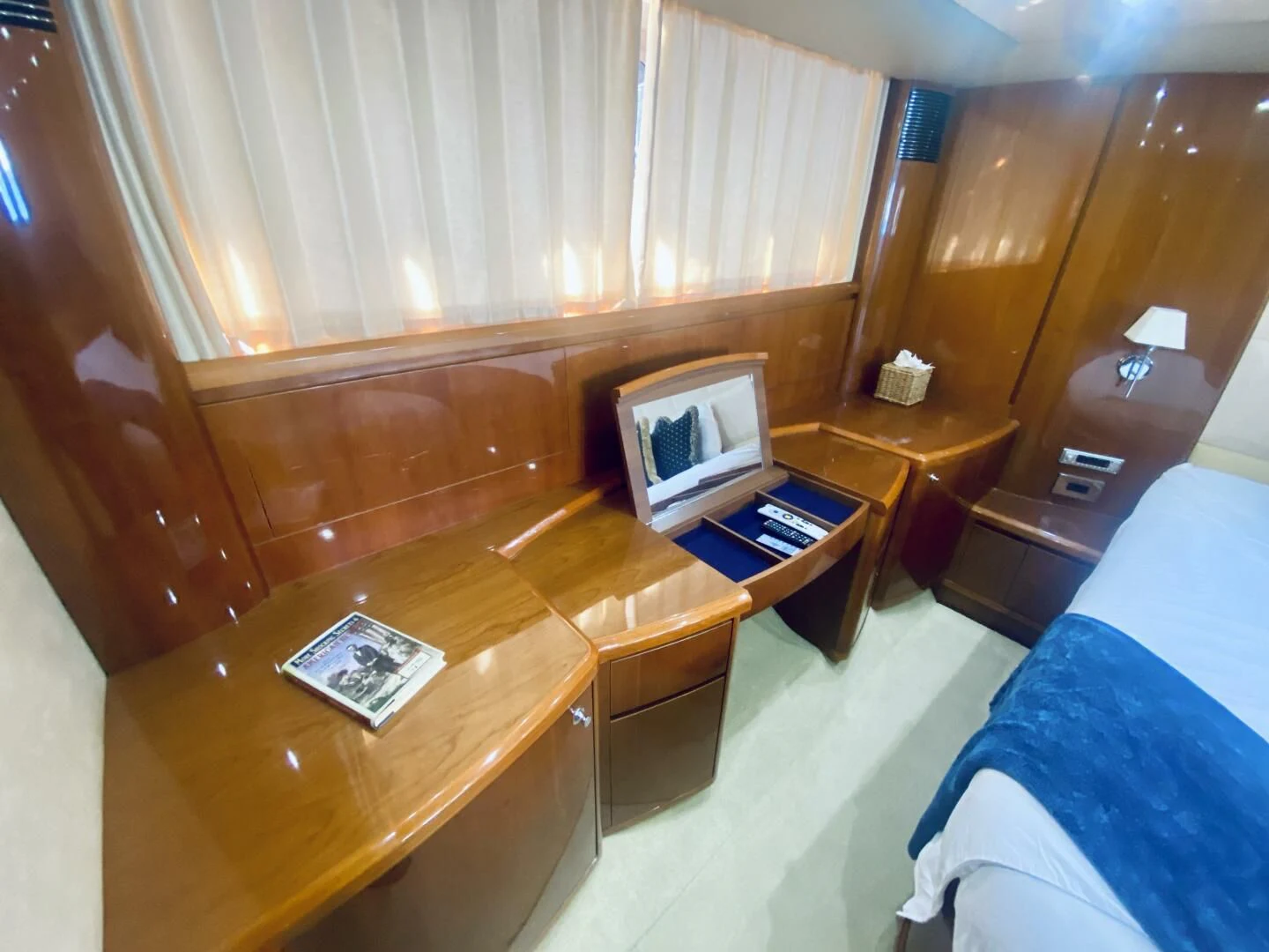 a room with a desk and a bed aboard GRAND CRU Yacht for Sale