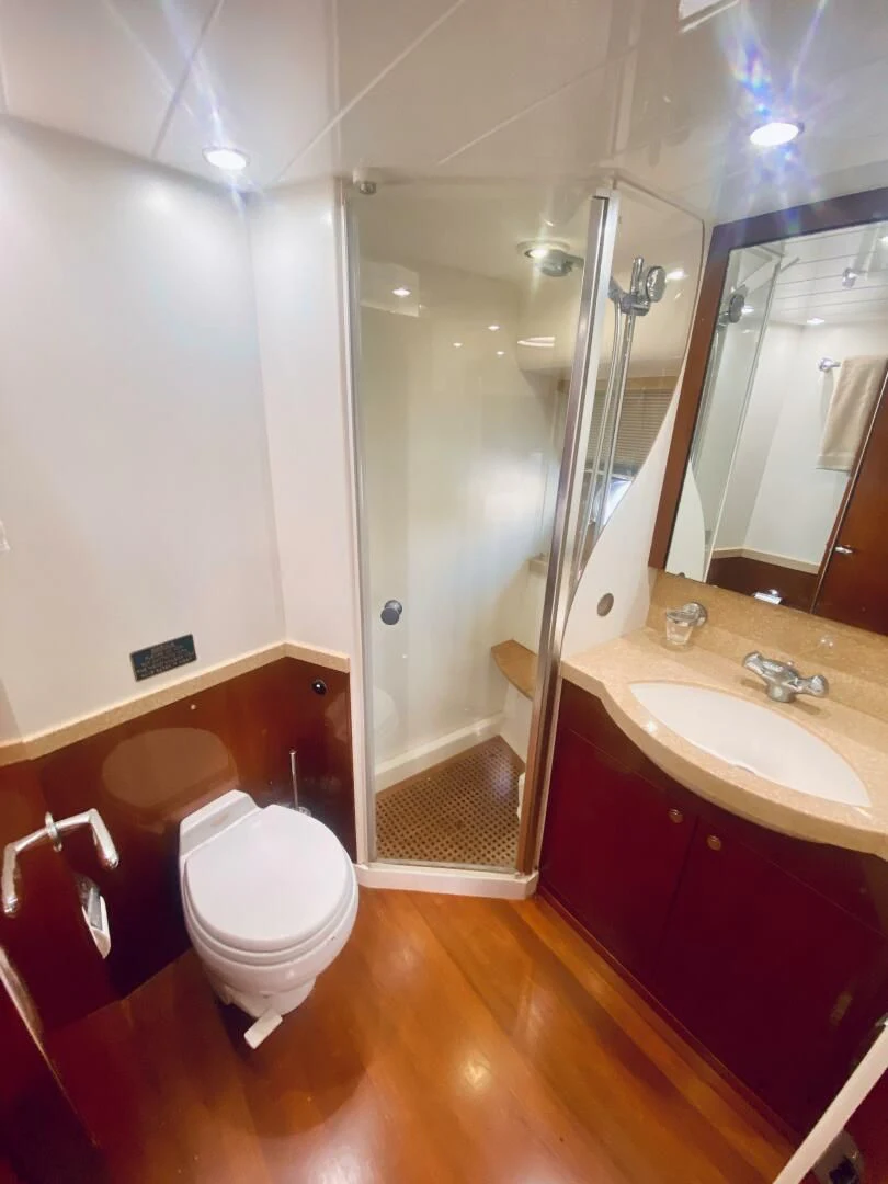 a bathroom with a shower and toilet aboard GRAND CRU Yacht for Sale