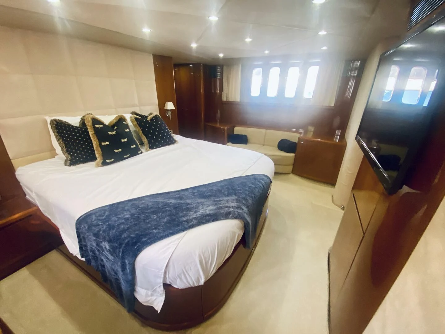 a room with a bed and a television aboard GRAND CRU Yacht for Sale