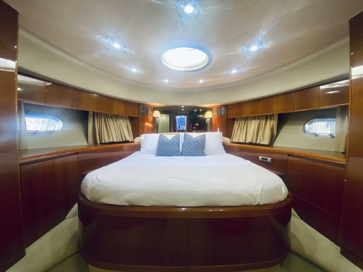 a room with a bed and a window aboard GRAND CRU Yacht for Sale
