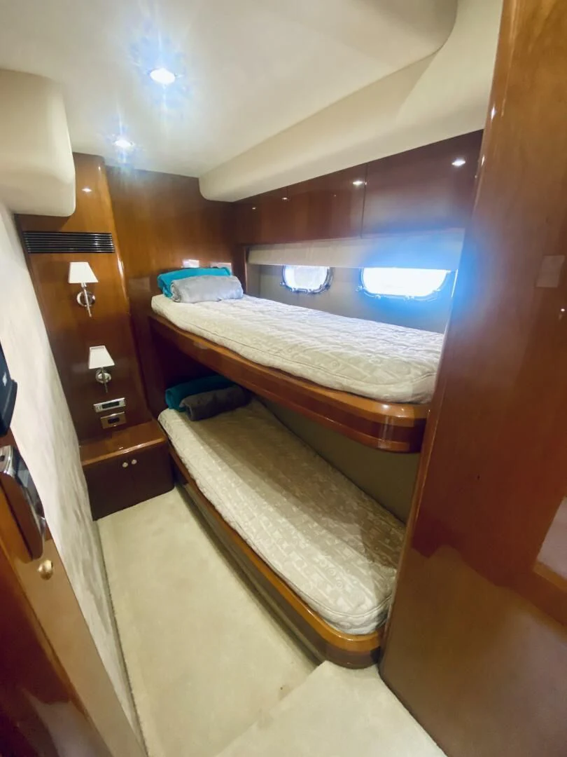a room with a bed and a window aboard GRAND CRU Yacht for Sale