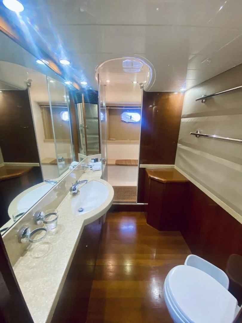 a bathroom with a large mirror aboard GRAND CRU Yacht for Sale