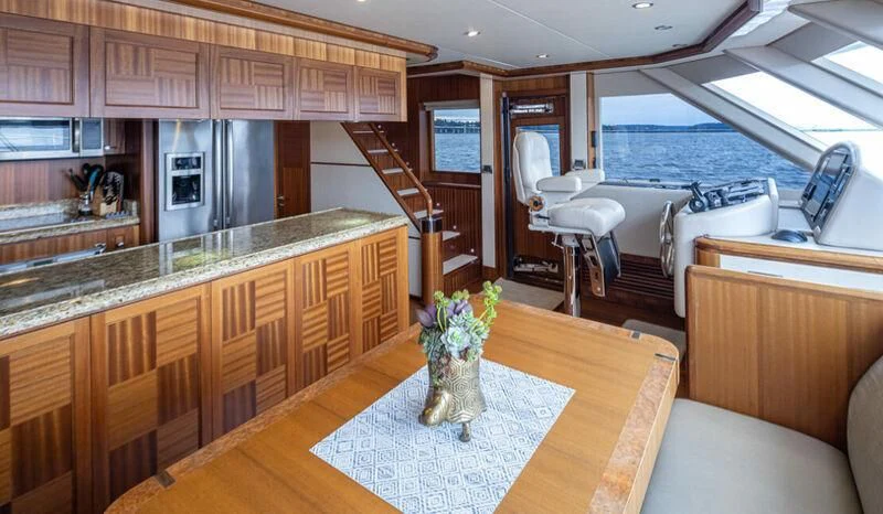 a kitchen with a large window aboard SPILL POINT Yacht for Sale