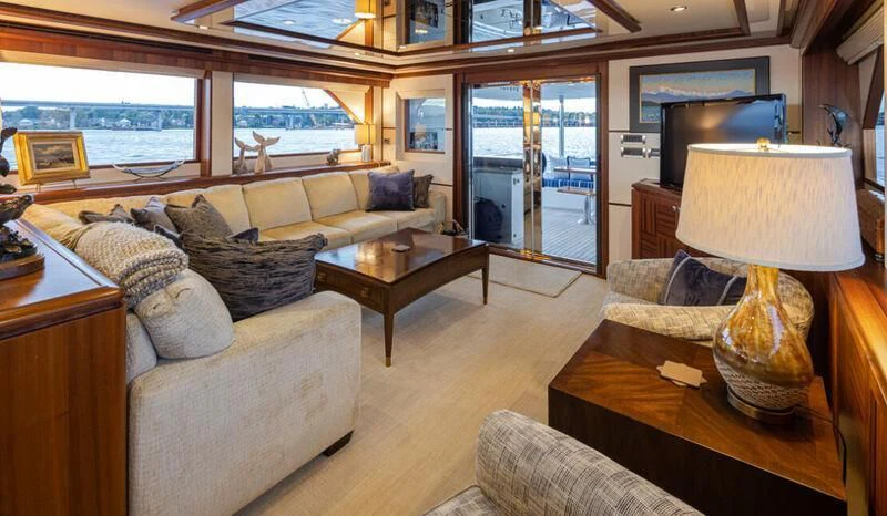 a living room with a large window aboard SPILL POINT Yacht for Sale