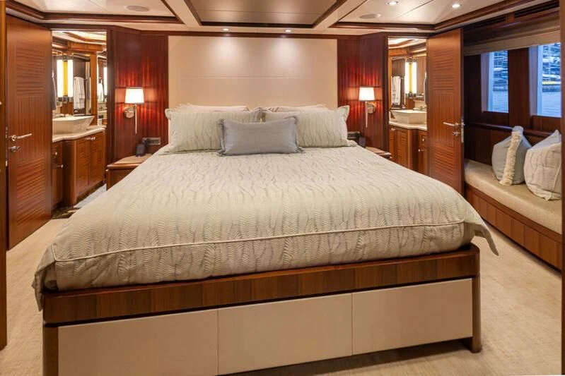 a bed with a white comforter aboard SPILL POINT Yacht for Sale