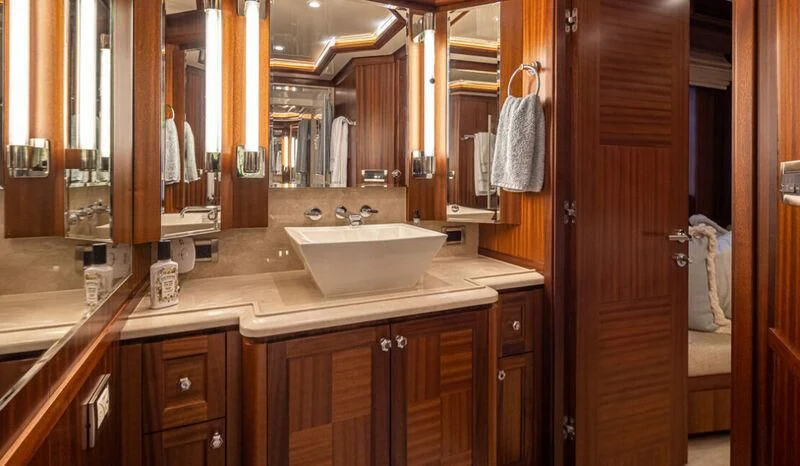 a bathroom with a sink and cabinets aboard SPILL POINT Yacht for Sale