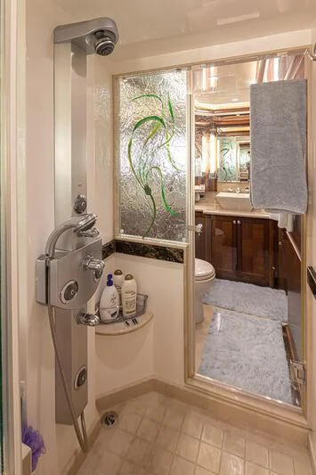 a bathroom with a sink and a mirror aboard SPILL POINT Yacht for Sale