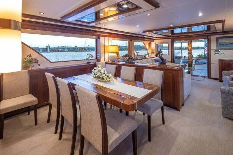 a large dining table in a room aboard SPILL POINT Yacht for Sale