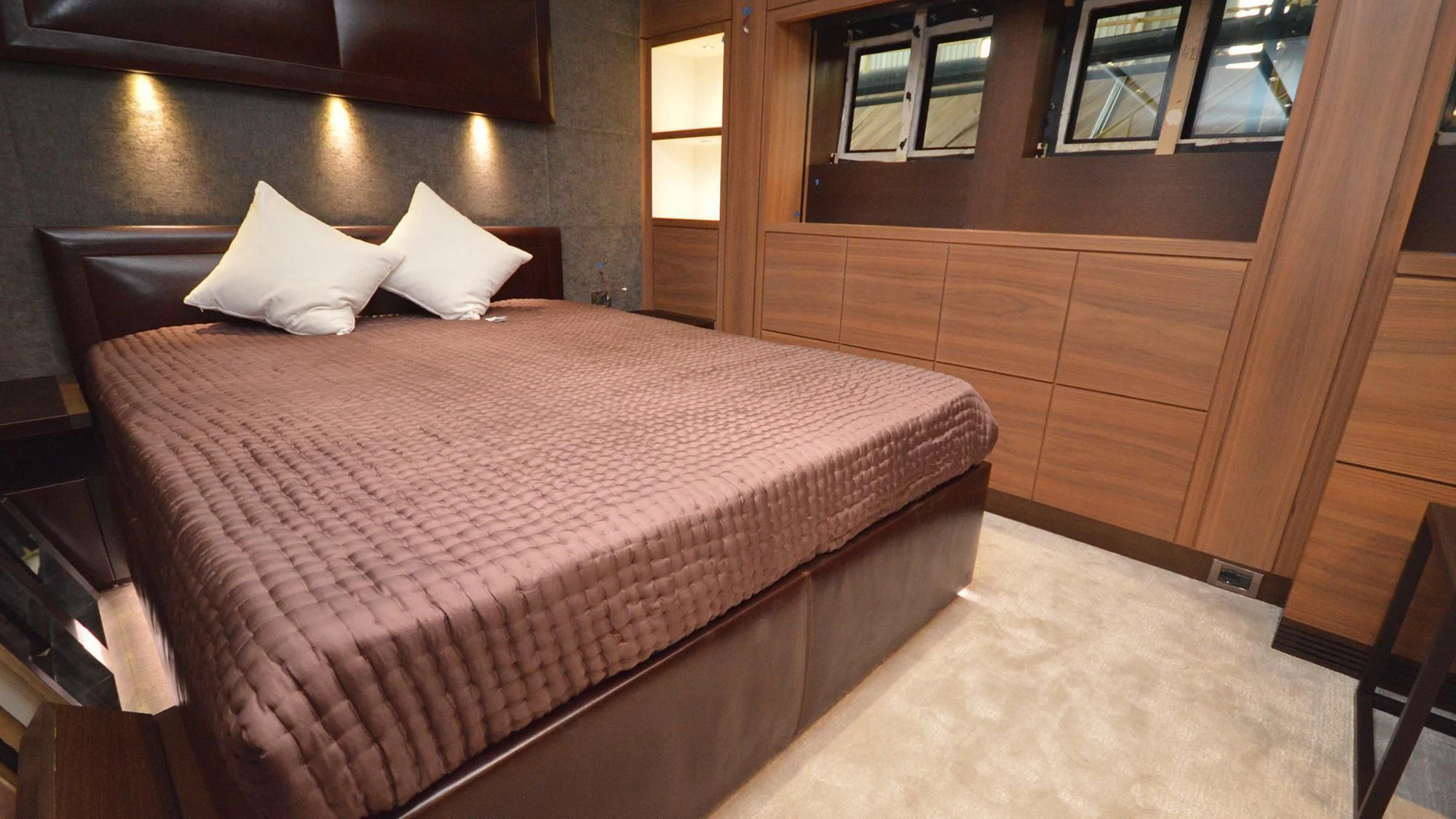 a bed in a room aboard NAVIS ONE Yacht for Charter