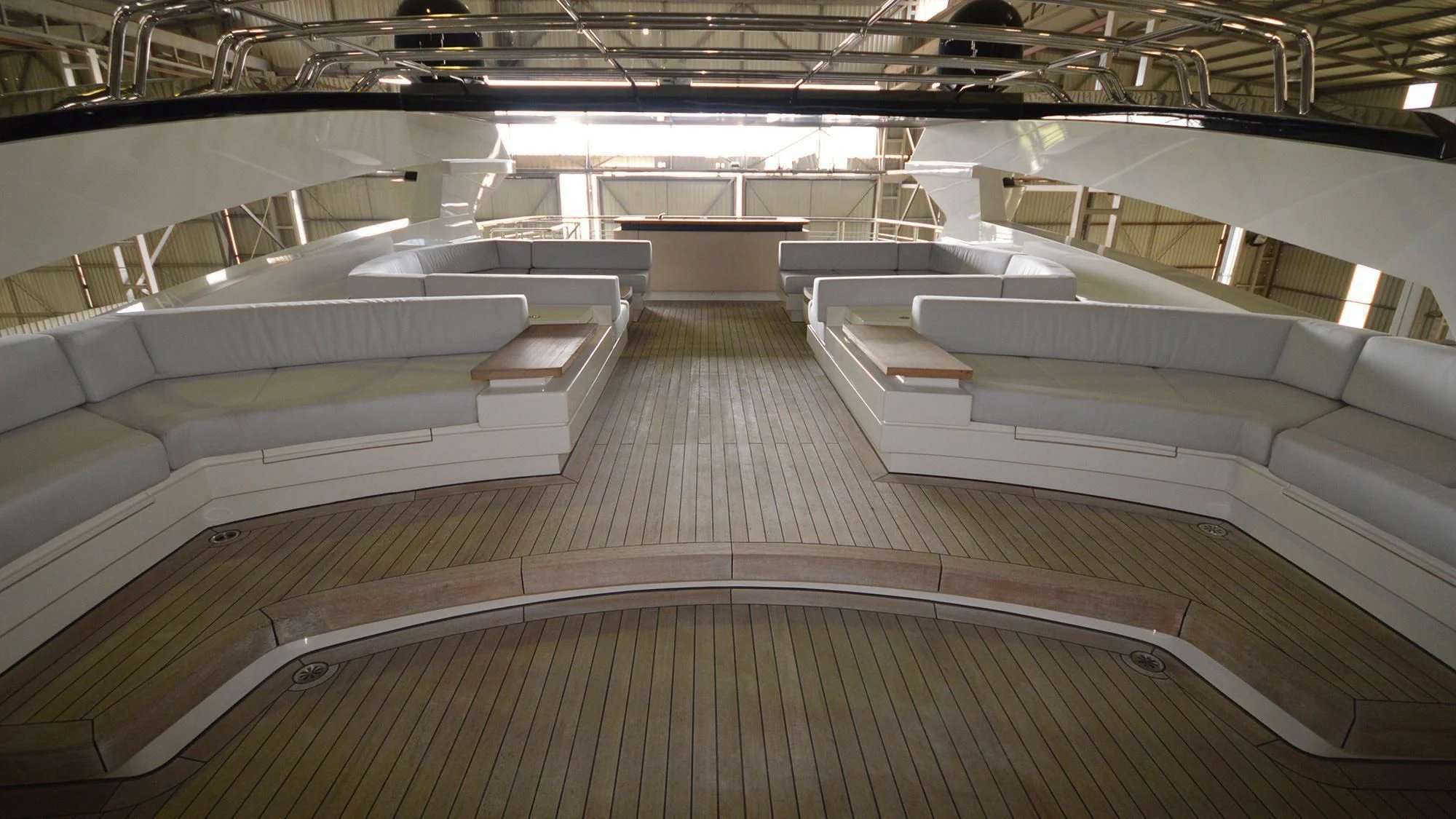 a room with several white seats aboard NAVIS ONE Yacht for Charter