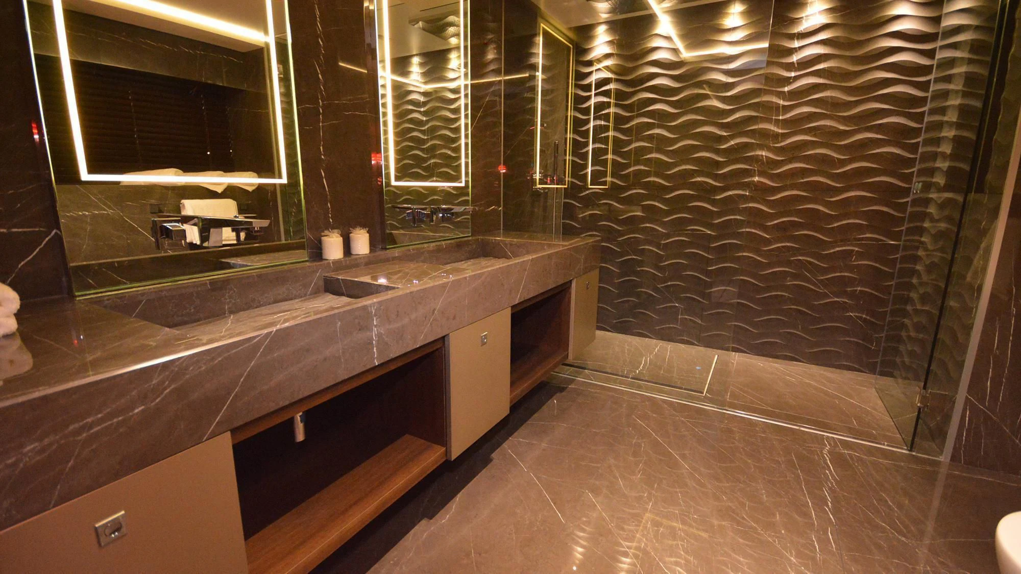 a bathroom with a large countertop aboard NAVIS ONE Yacht for Charter