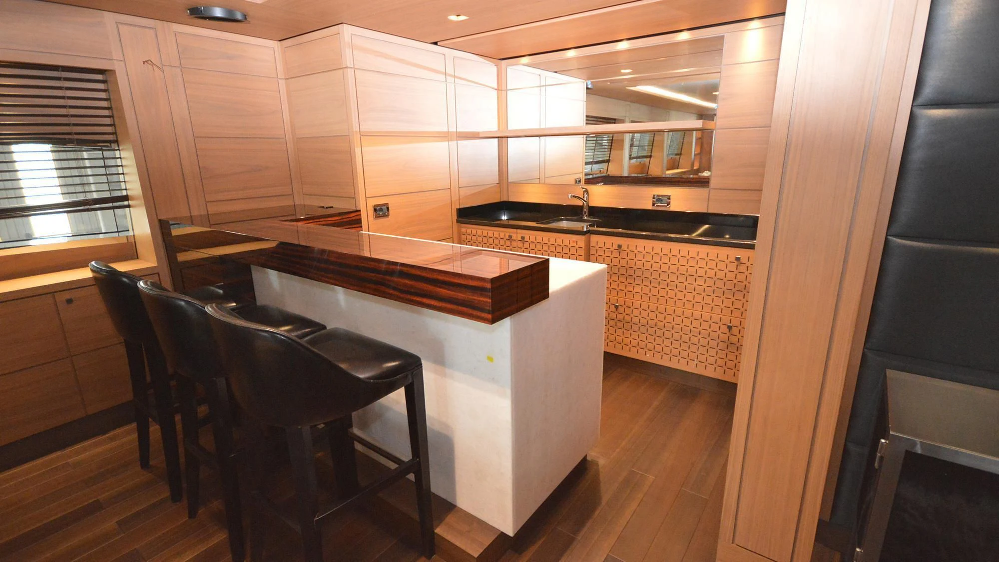 a kitchen with a sink and a table aboard NAVIS ONE Yacht for Charter