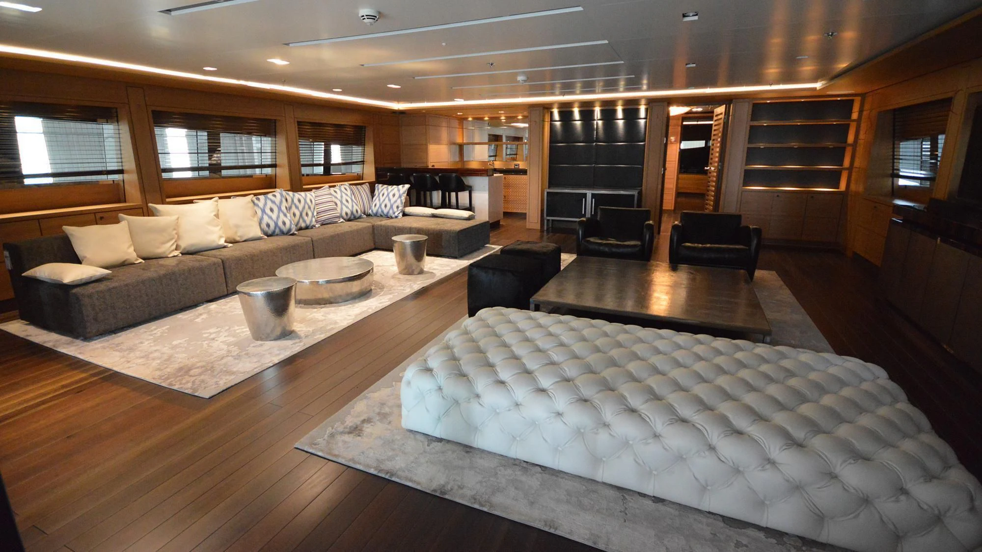 a living room with a large couch aboard NAVIS ONE Yacht for Charter