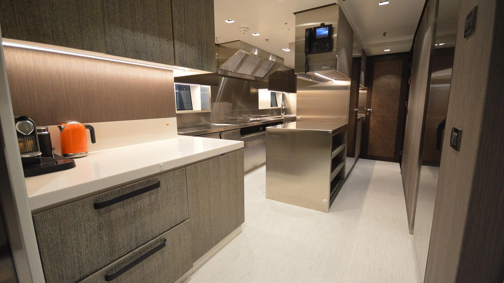 a kitchen with a stove and a sink aboard NAVIS ONE Yacht for Charter