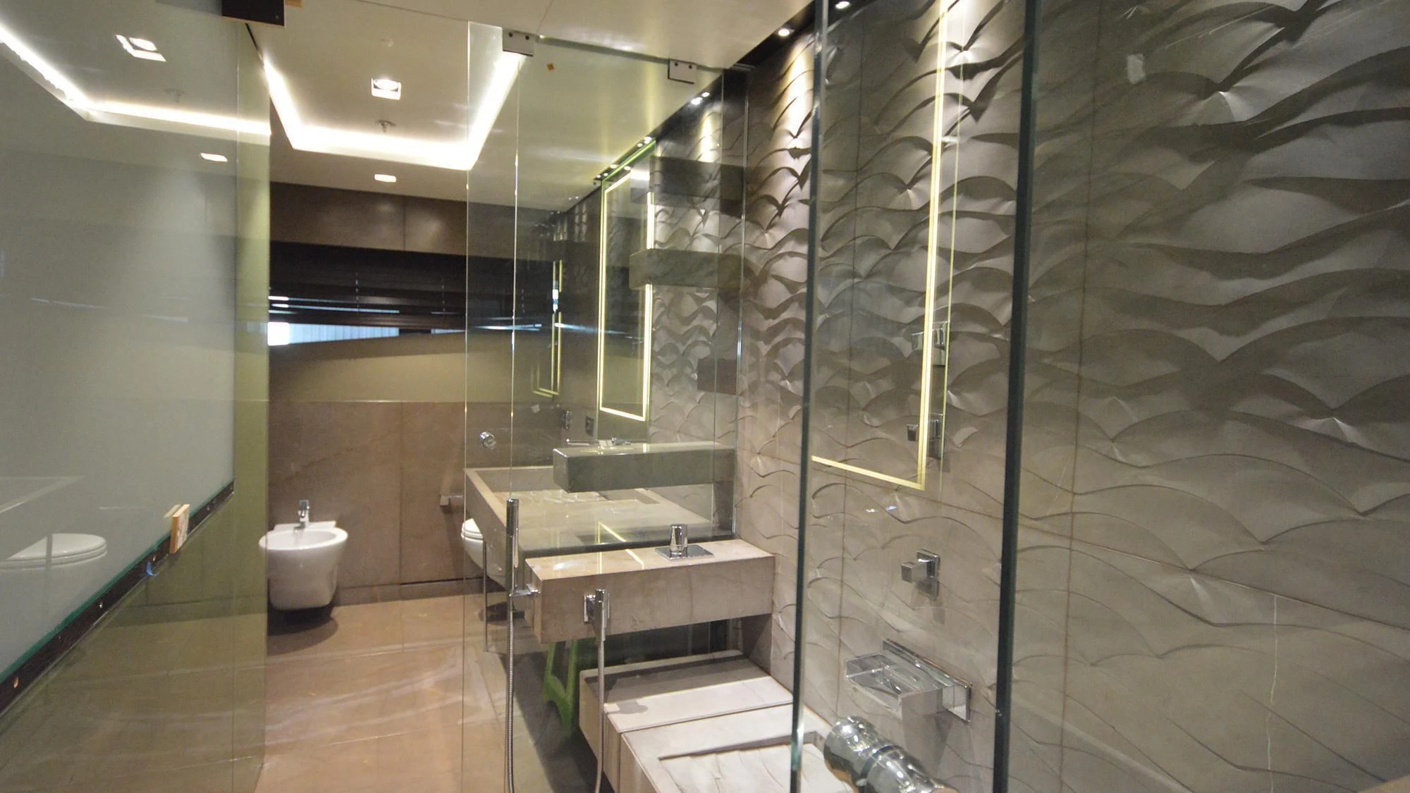 a bathroom with a glass shower aboard NAVIS ONE Yacht for Charter