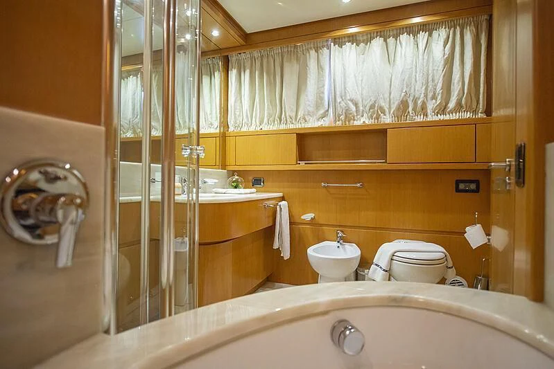 a bathroom with a glass shower aboard LADY EMESA Yacht for Sale