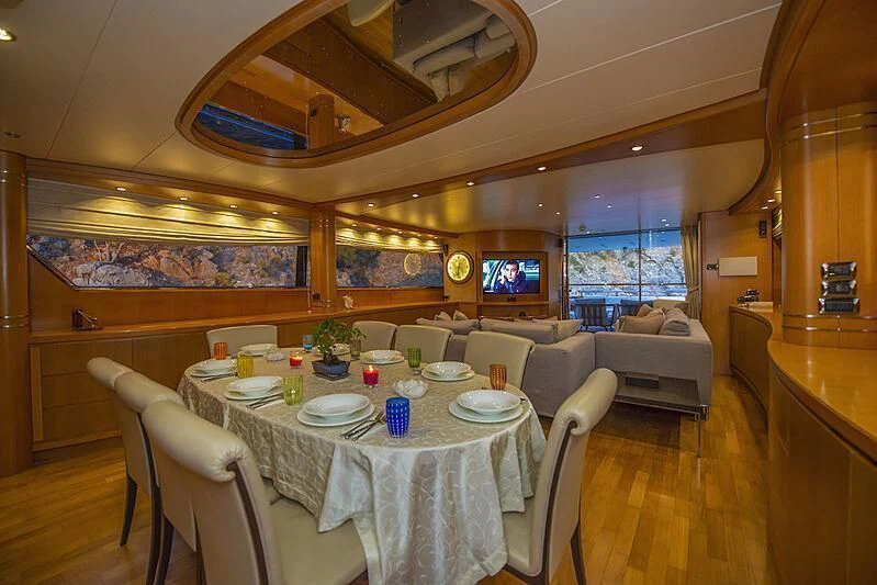 a dining room with a table and chairs aboard LADY EMESA Yacht for Sale