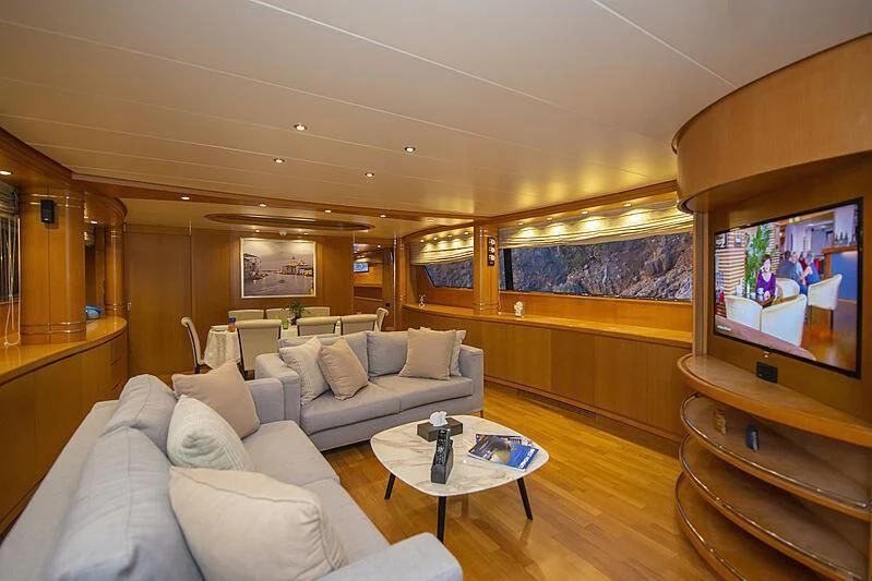 a living room with a large television aboard LADY EMESA Yacht for Sale