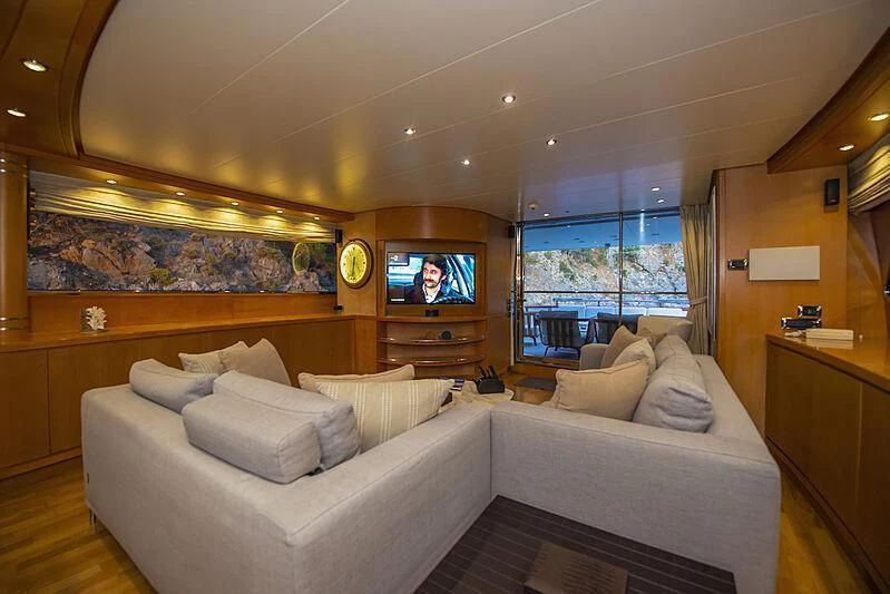 a living room with a large television aboard LADY EMESA Yacht for Sale